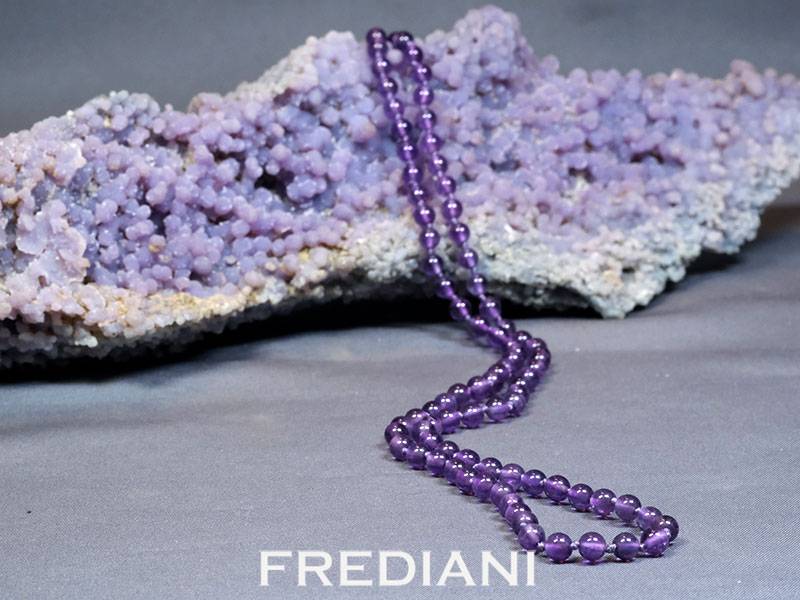 Collier en boules d'améthystes et fermoir en argent 925/000
